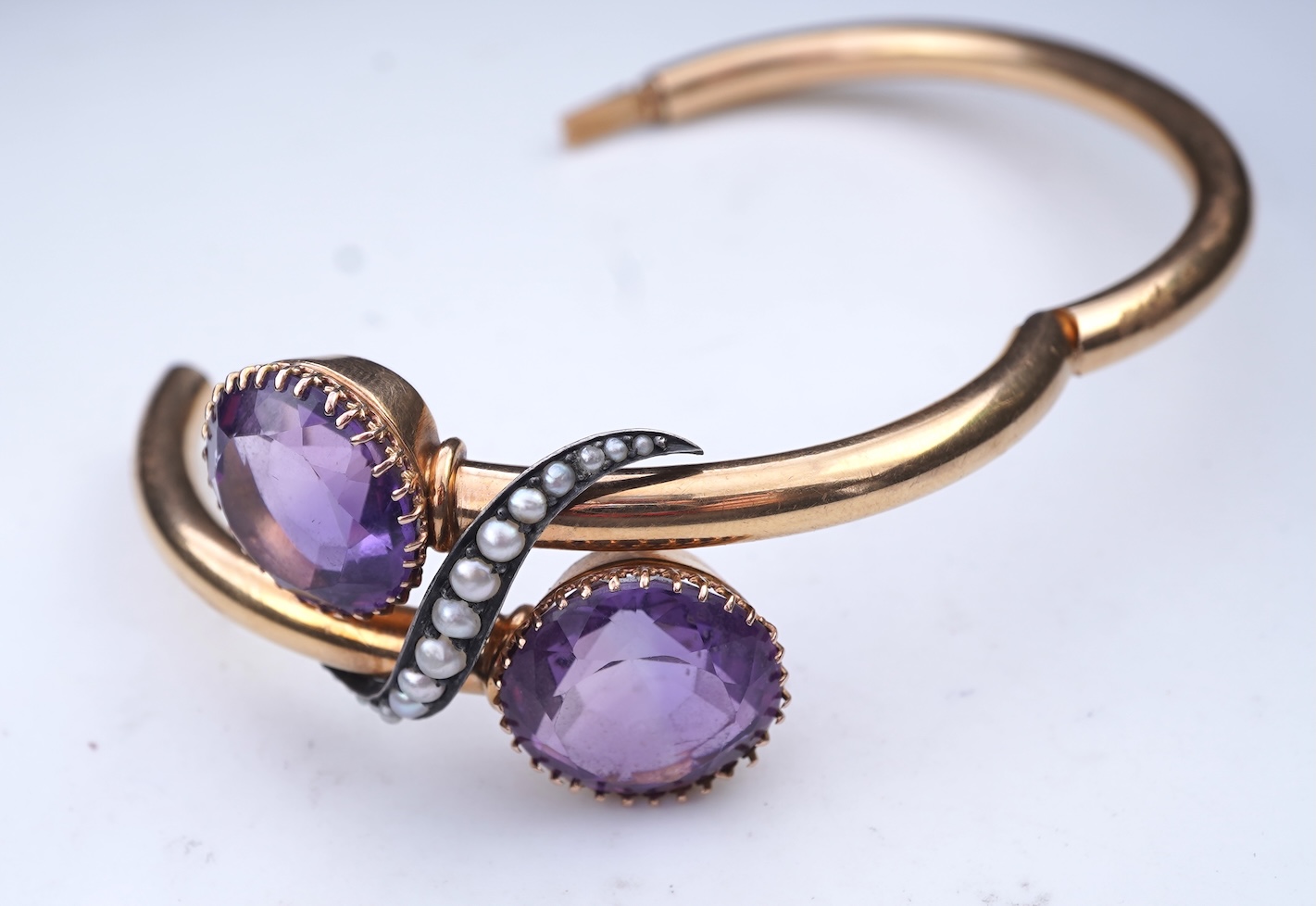 A Victorian gold, pearl and amethyst bangle, late 19th century